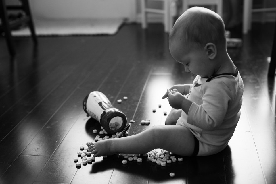 Family Documentary Photography - black and white baby with puffs