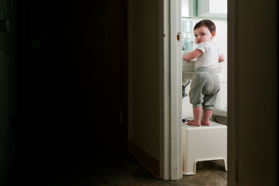 Family Documentary Photography - baby at sink in bathroom