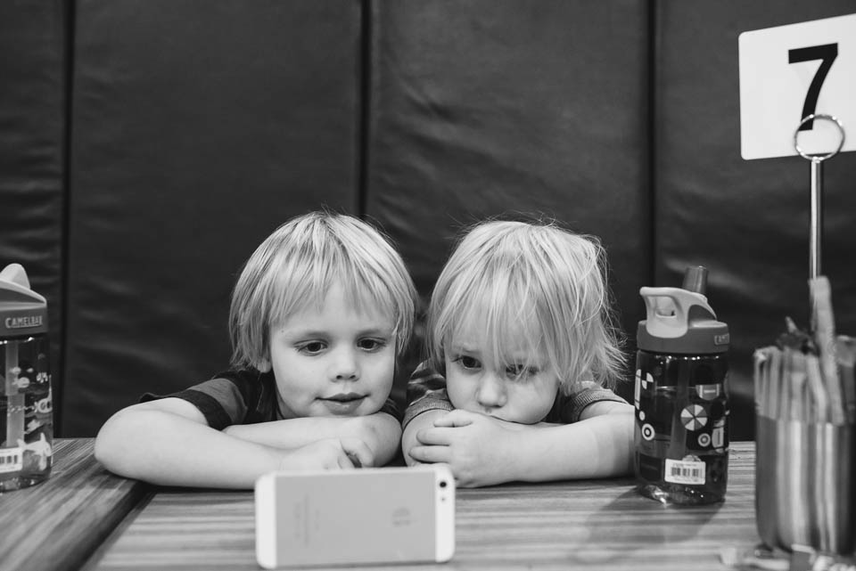 Little kids watch iPhone - Family Documentary Photography