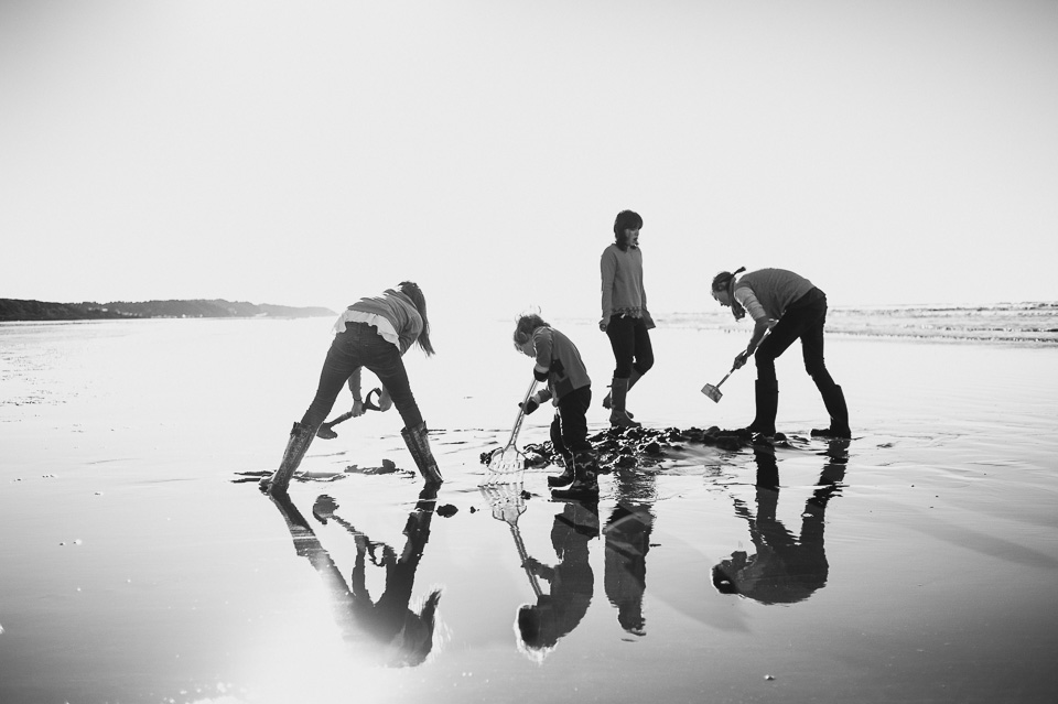 Family Documentary Photography - Black and White kids dig in sand on the beach