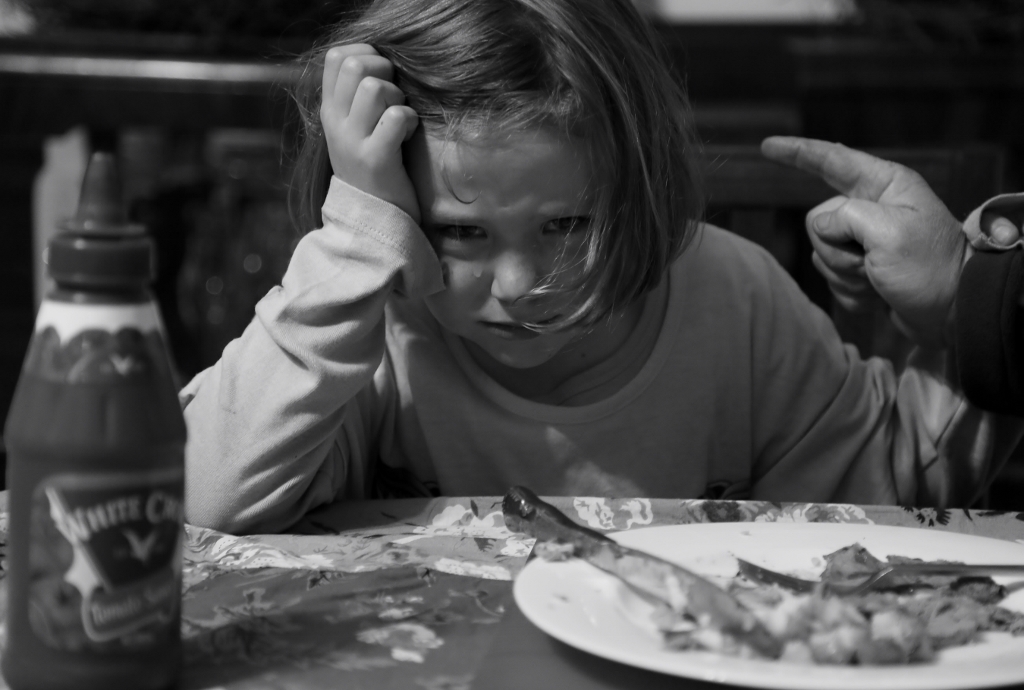 girl is scolded for not eating