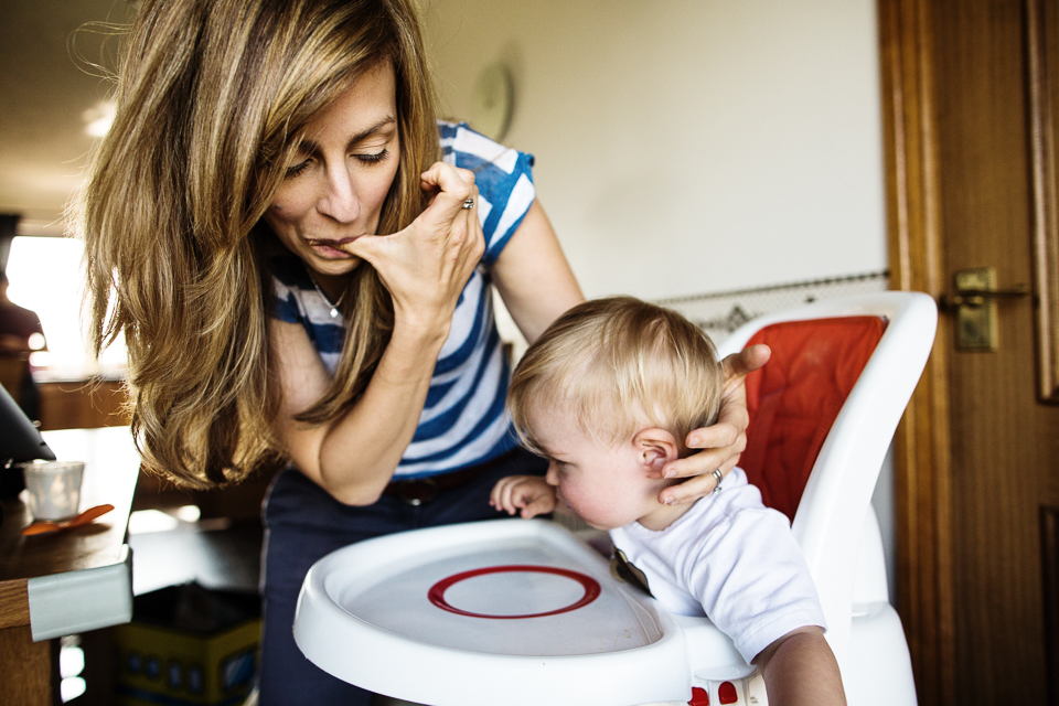 mom licks baby food off finger 