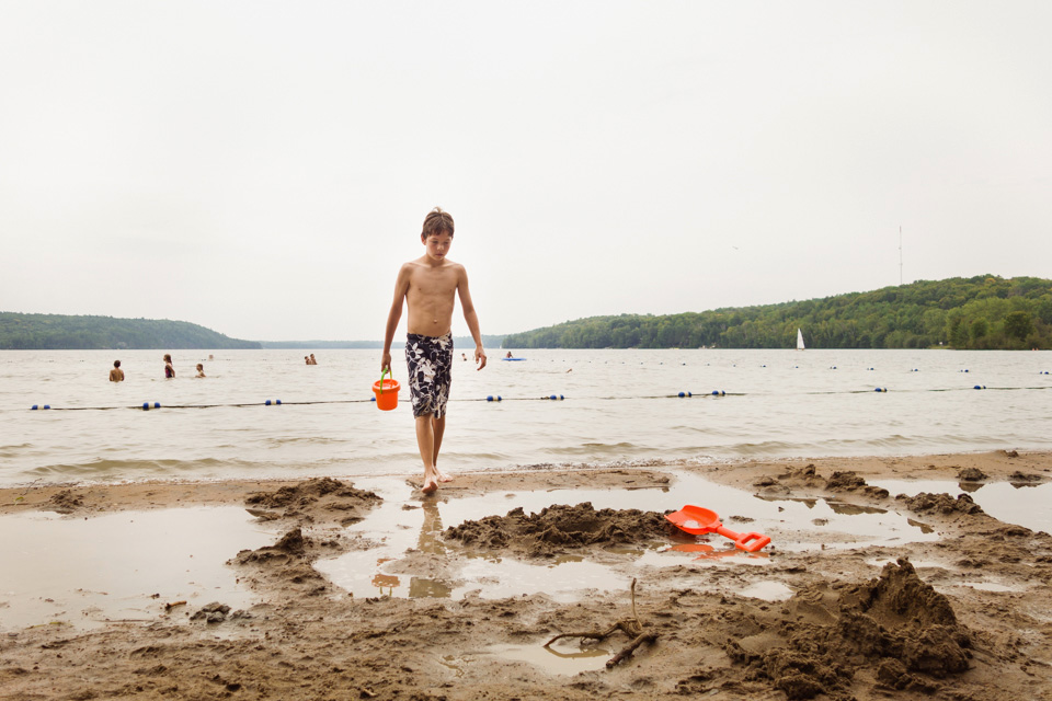boy walking on beach - Family documentary photography