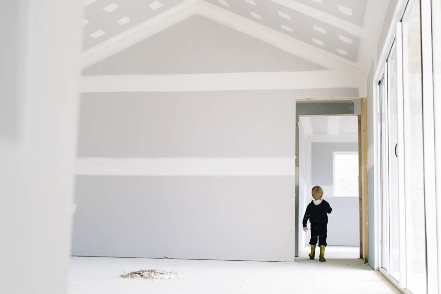 boy in door of empty room - Family documentary photography