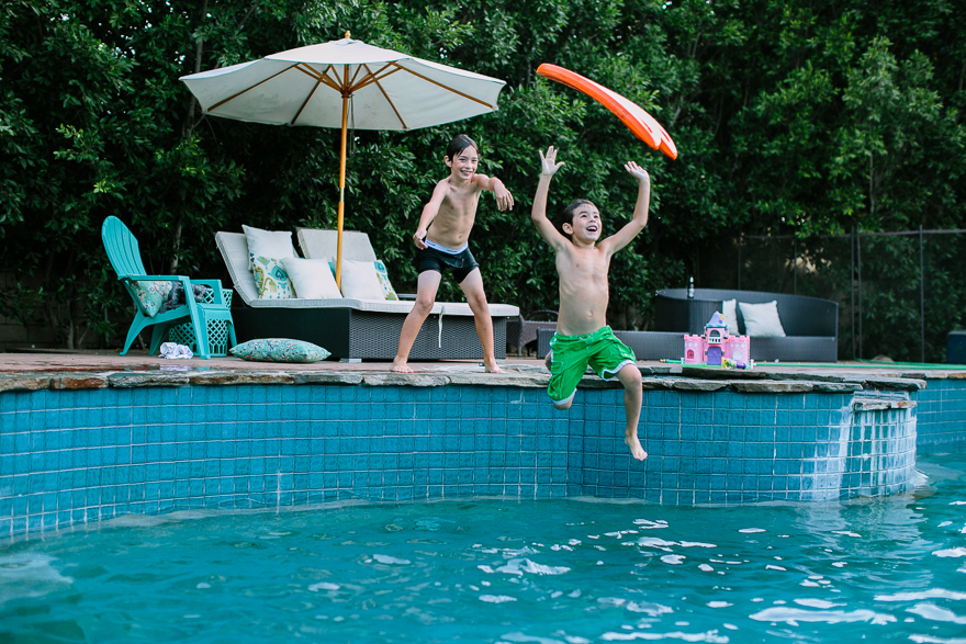 kids jumping in pool - family documentary photography