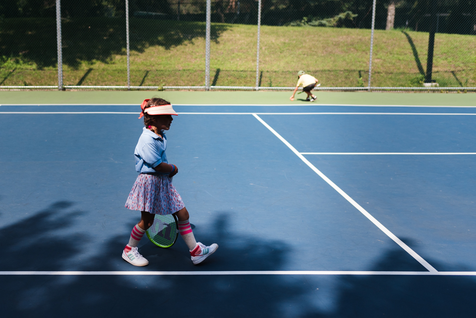 girl on tennis court - family documentary photography 