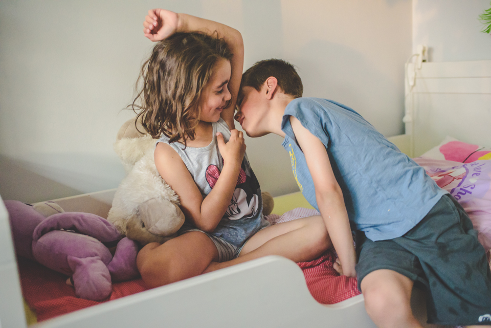 boy smelling armpit - family documentary photography