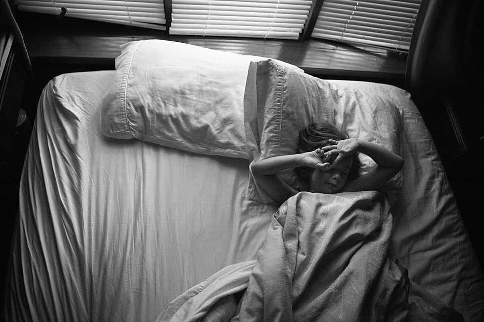 Girl in bed - family documentary photography 