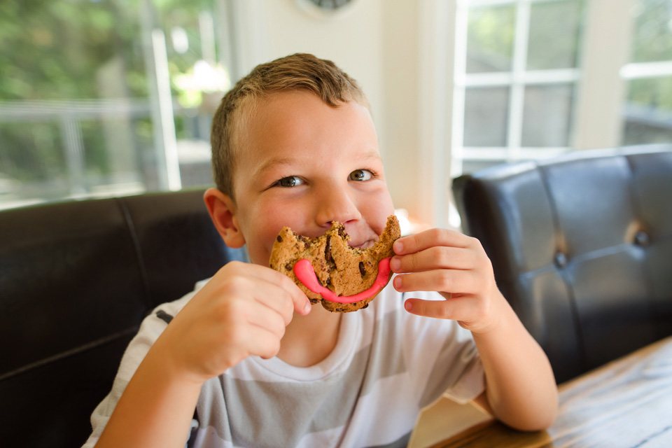 boy with cookie mouth - Family documentary photography