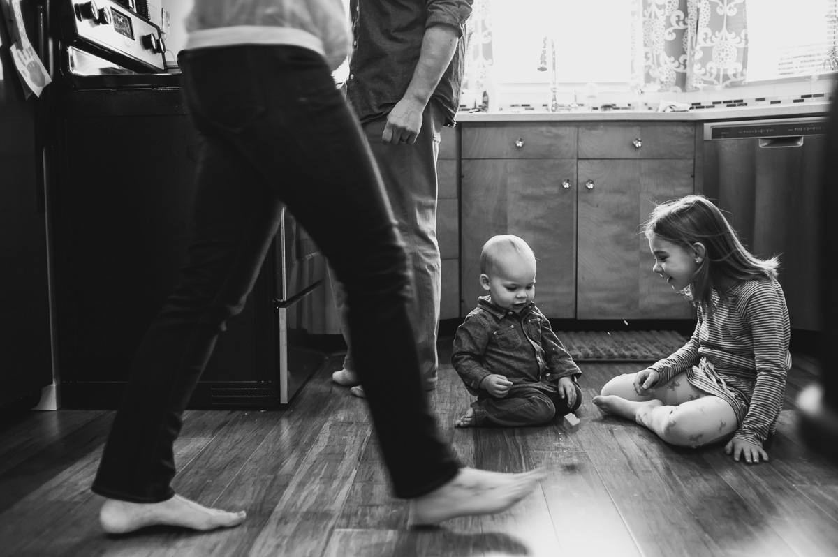 kids playing on kitchen floor