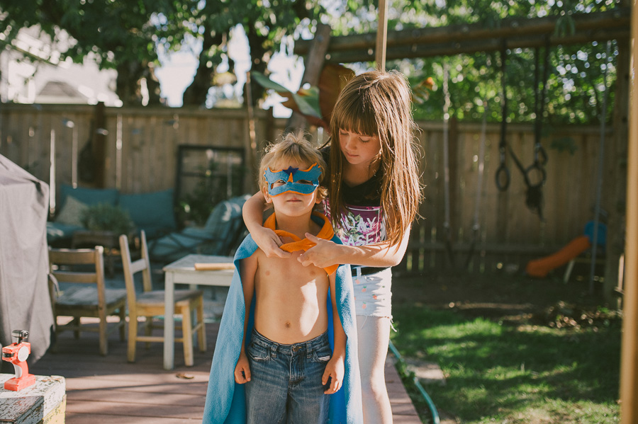 boy in super hero cape and mask - family documentary photography