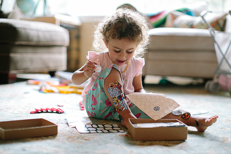 girl with stickers - family documentary photography 