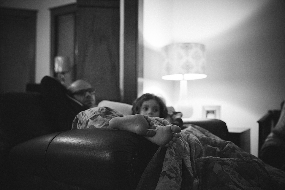 girl on couch with blankets - documentary family photography