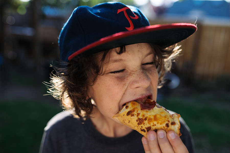 Boy eating pizza - Family Documentary Photography