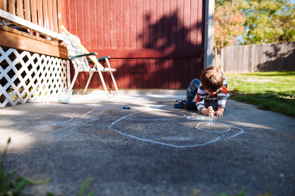 boy with sidewalk chalk - Family Documentary Photography