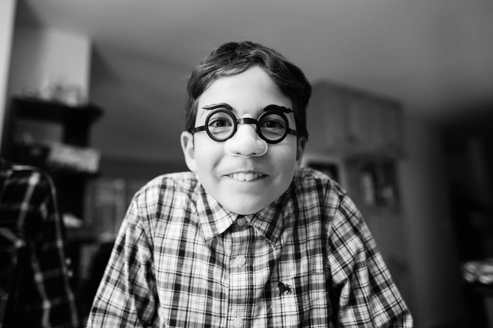 boy with joke glasses - documentary family photography