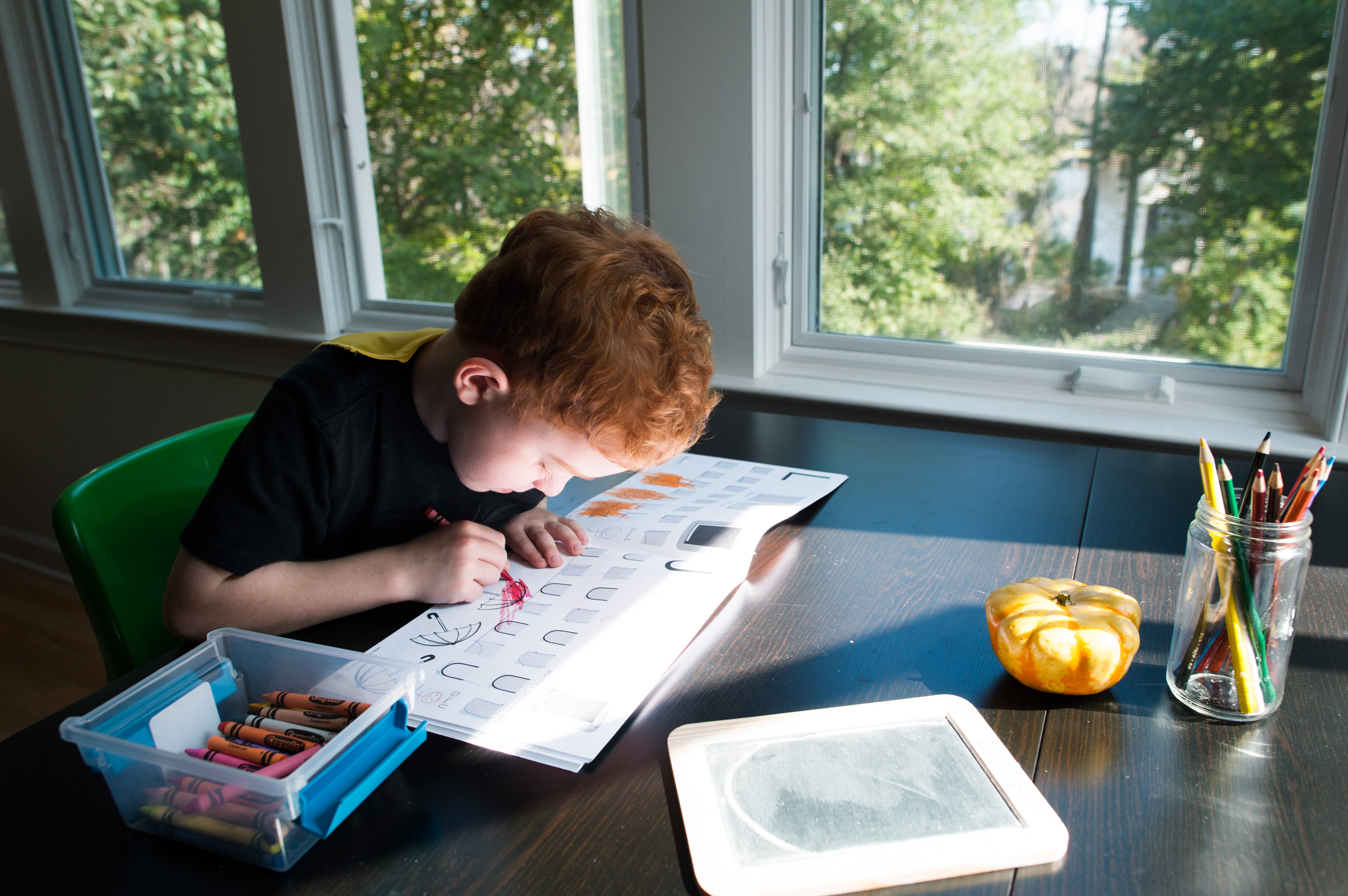 boy coloring - documentary family photography