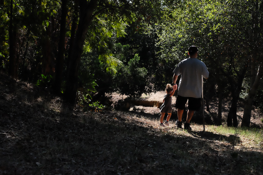 Man walking with child - at the park