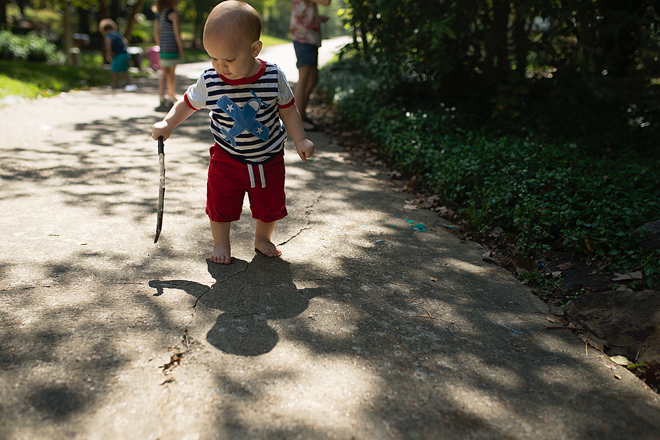 baby with walking stick - family documentary photography
