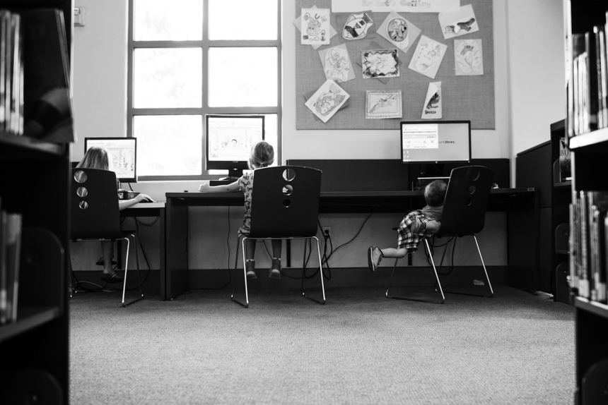 kids sitting at desks working on computer