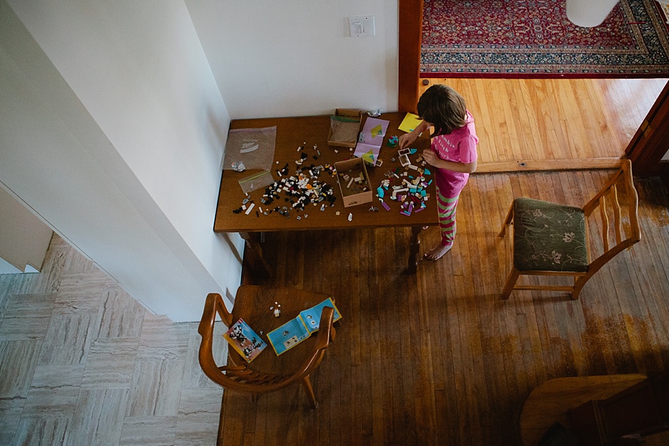Girl at table with legos - Family Documentary Photography