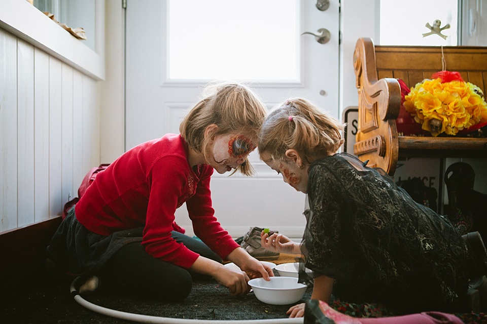 girls wash painted faces - family documentary photography