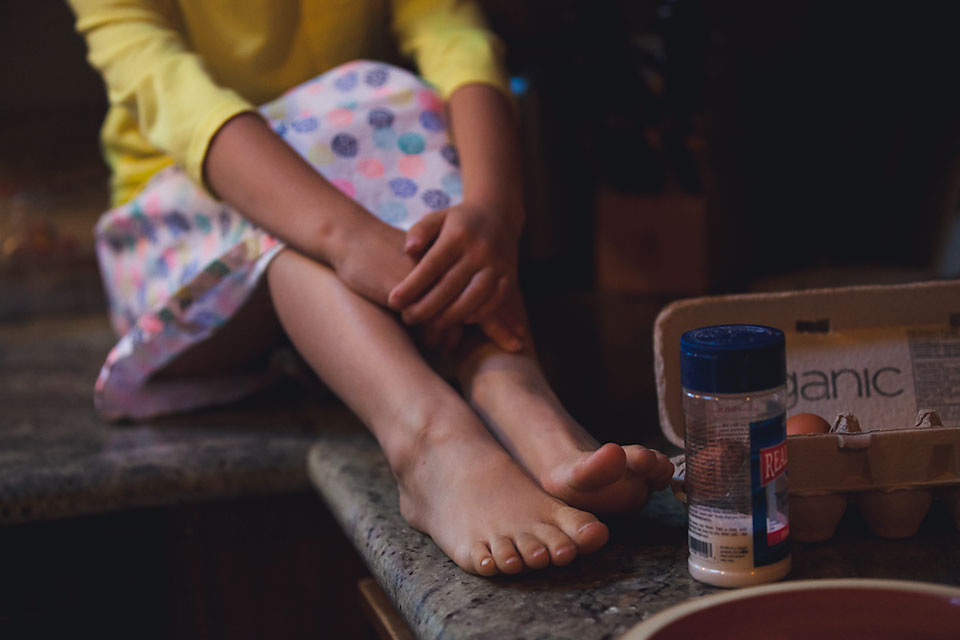 girl with feet on counter -Family Documentary Photography