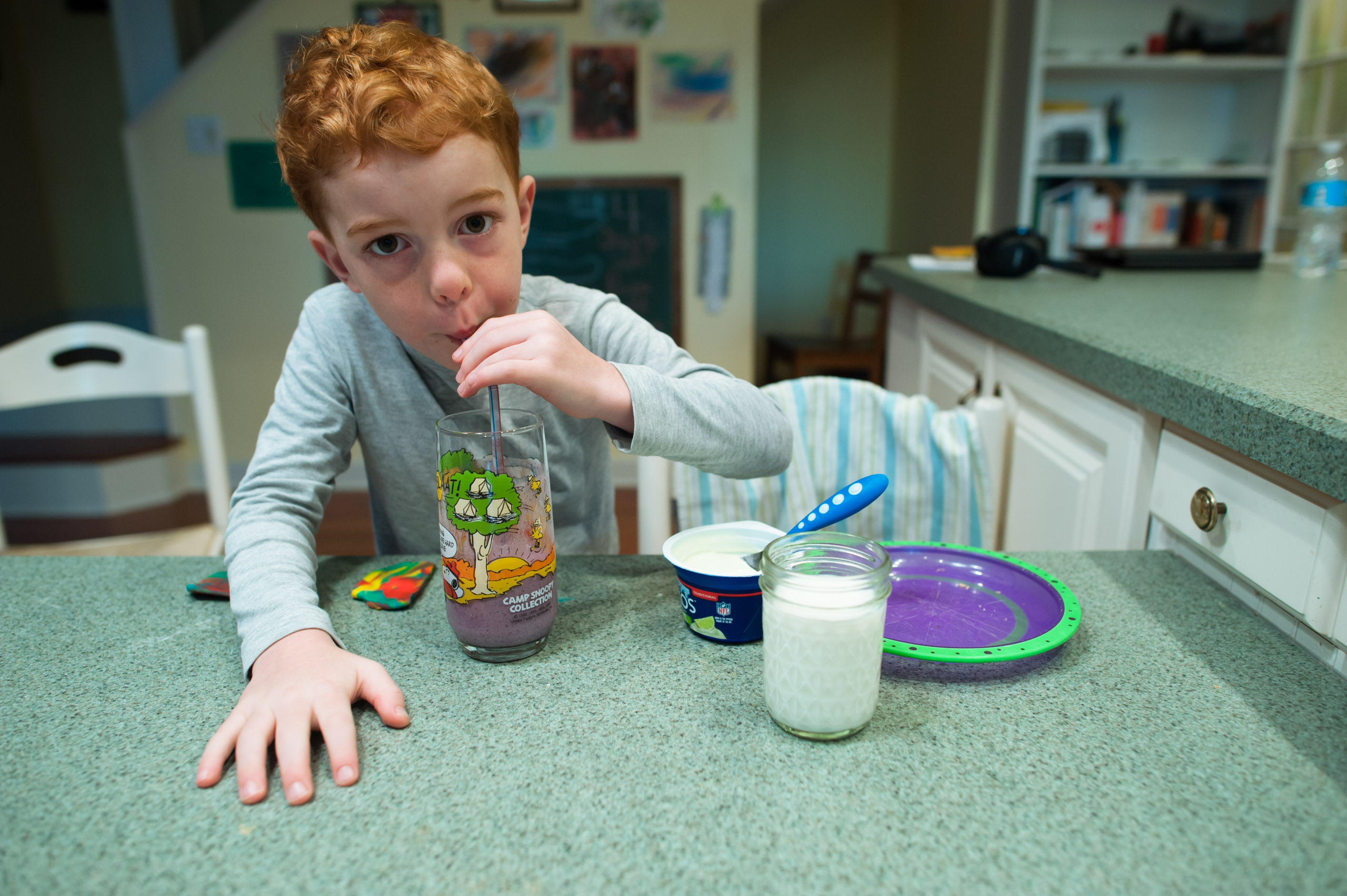 boy drinking from straw - family documentary photography