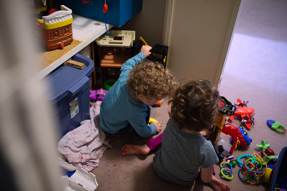 Kids play with toys in closet - Family Documentary Photography