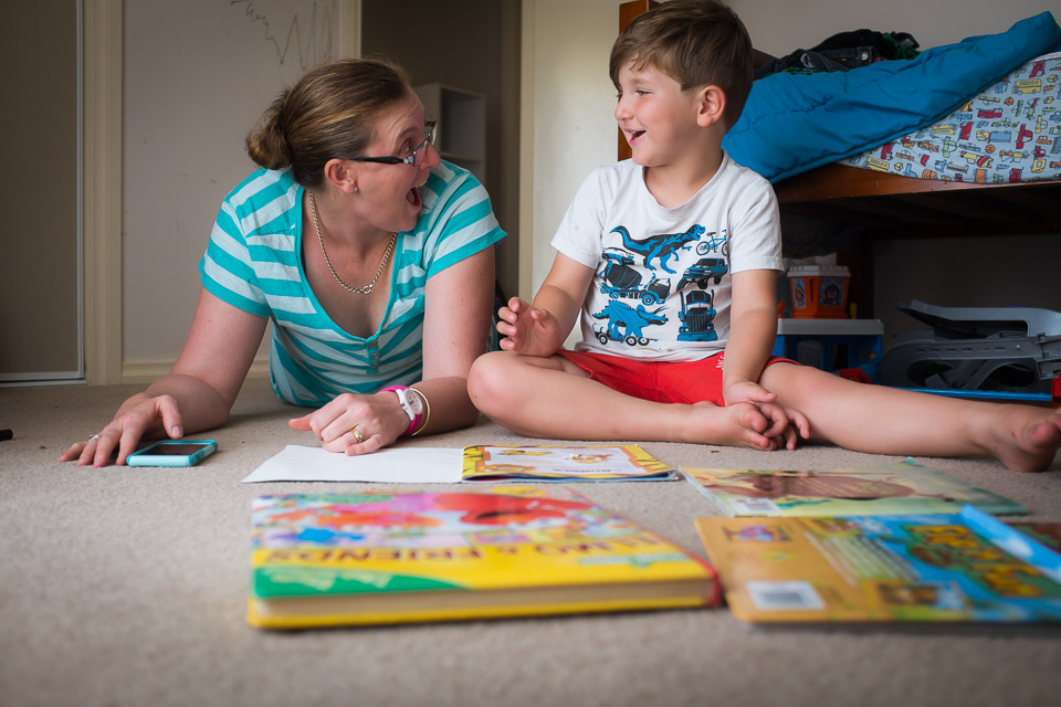 self portrait of mother reading with boy