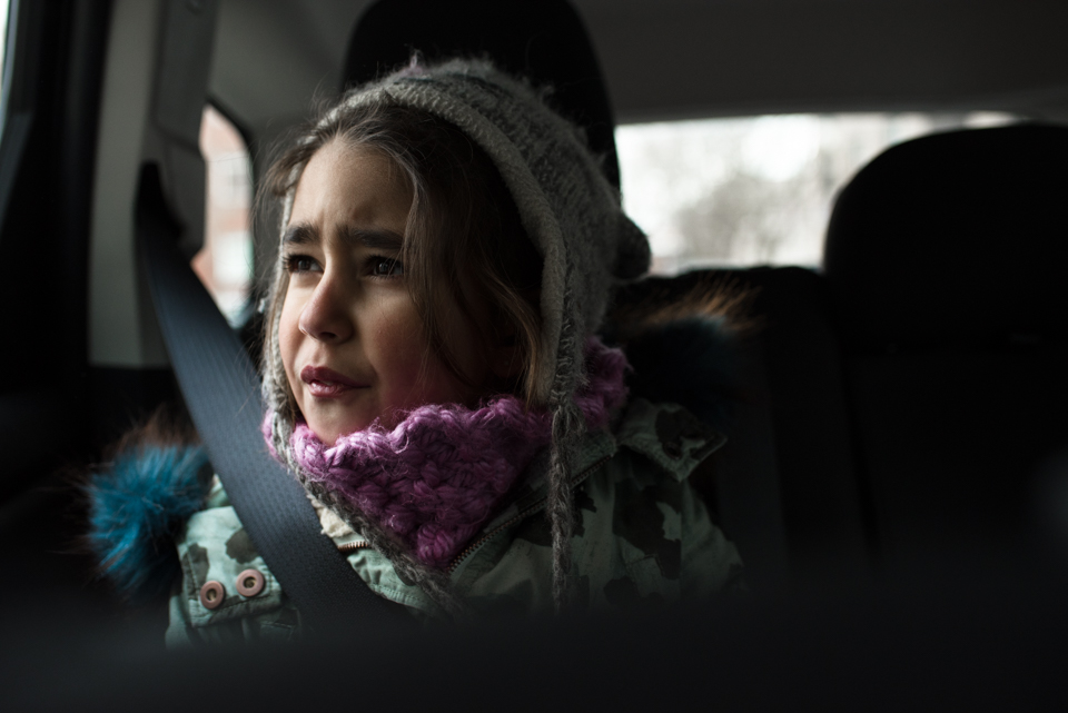 girl looking out car window - Family Documentary Photography