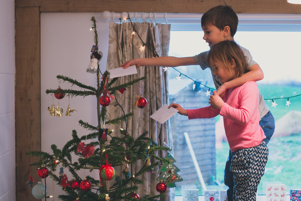 Kids at Christmas tree - Family Documentary Photography