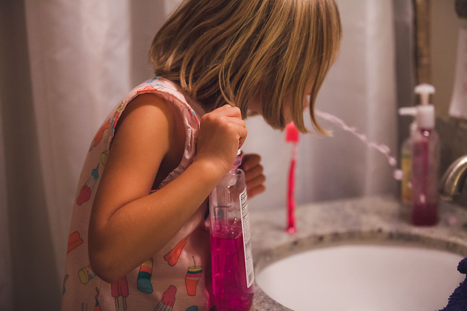 Girl Spitting in sink -Family Documentary Photography