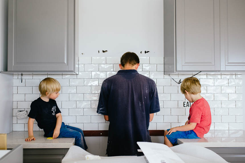 boys watch father with kitchen installation - Family Documentary Photography