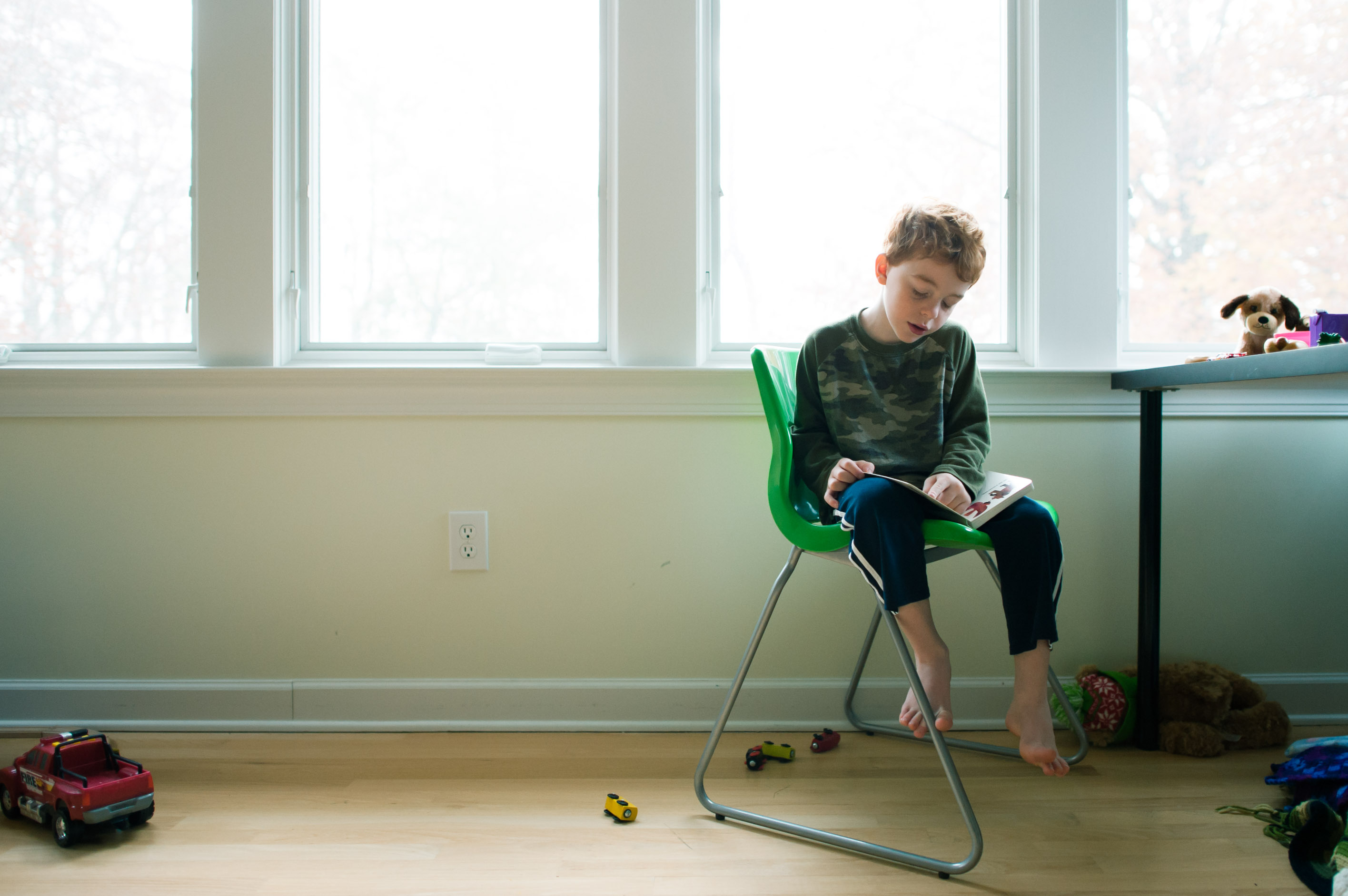 boy studies at window - Family Documentary Photography