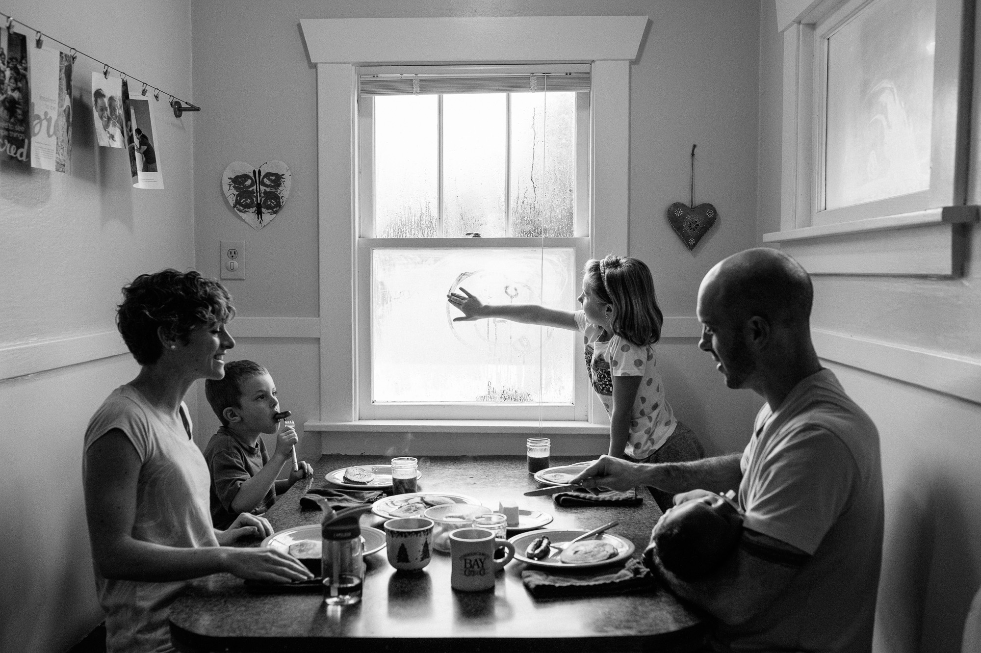 Family Sits at dinner - Family Documentary Photography