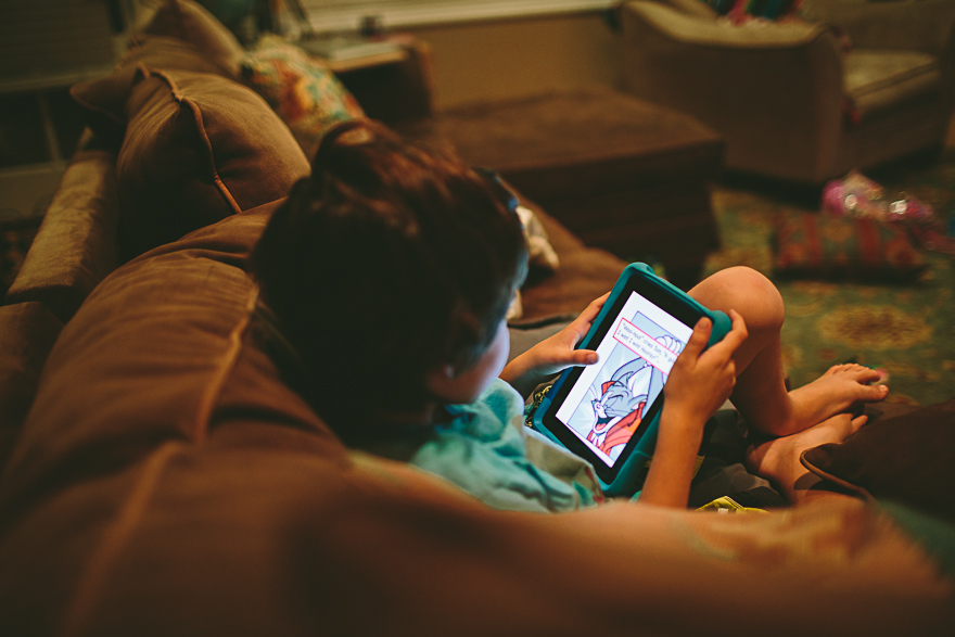 child plays with tablet - Family Documentary Photography