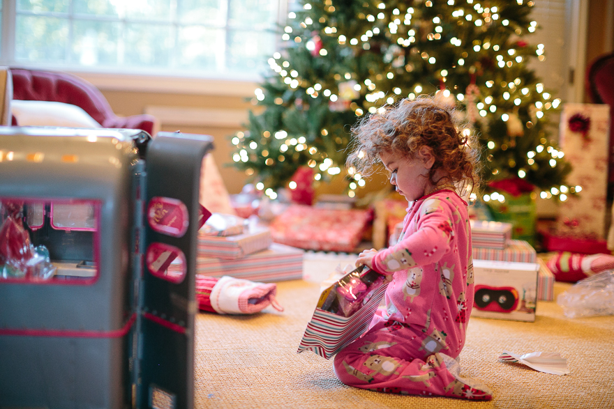 Girl opens present - Family Documentary Photography