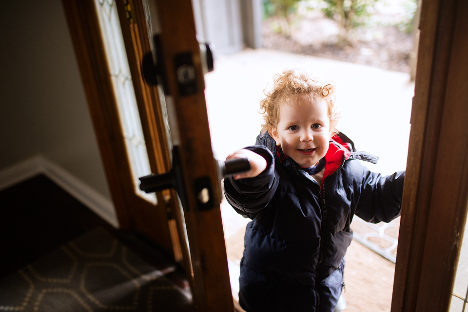 little boy closing door - Documentary Family Photography