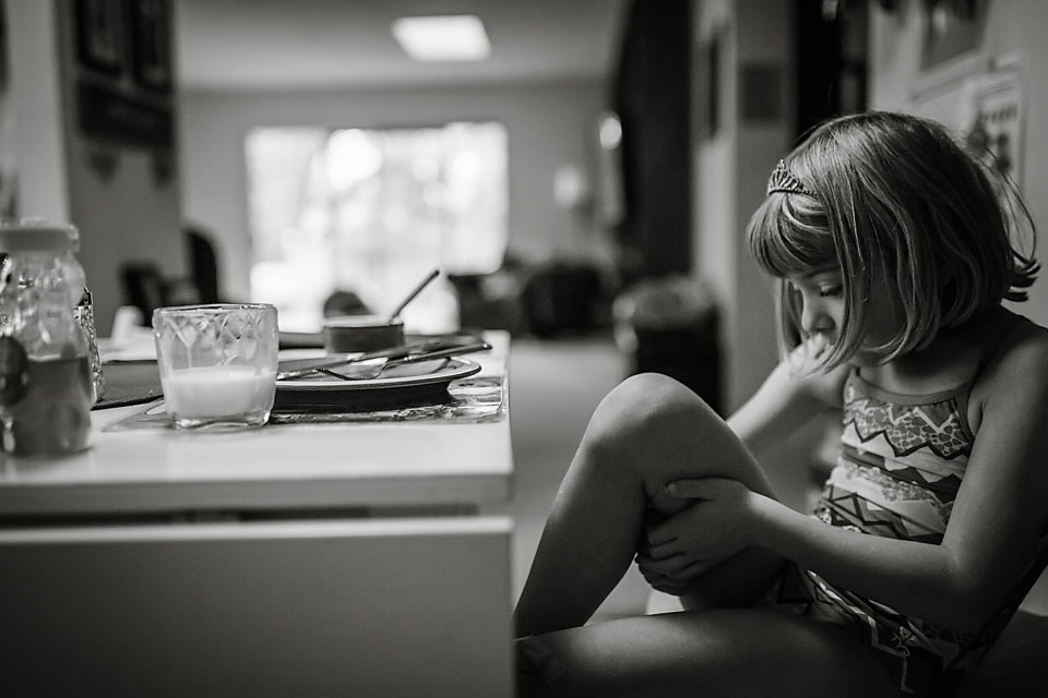 Girl at breakfast table - Documentary Family Photography