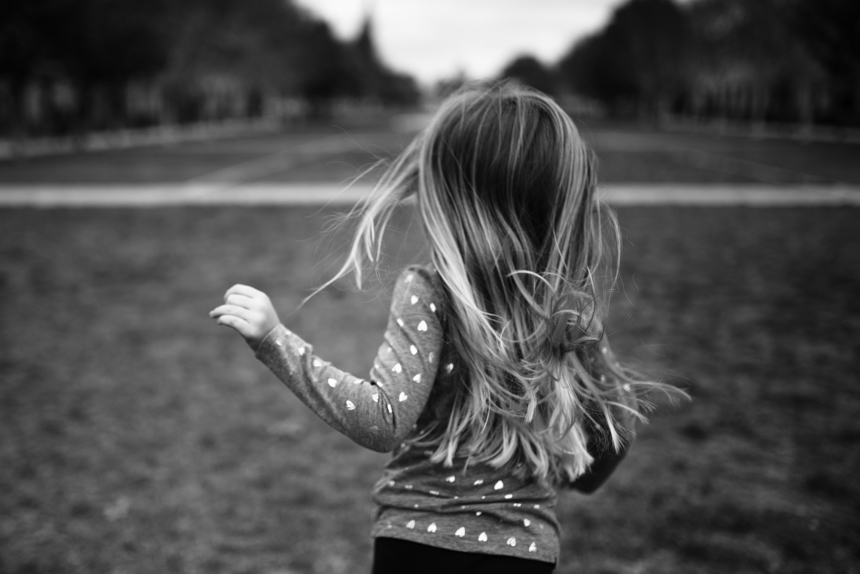 girl with long hair running - Documentary Family Photography