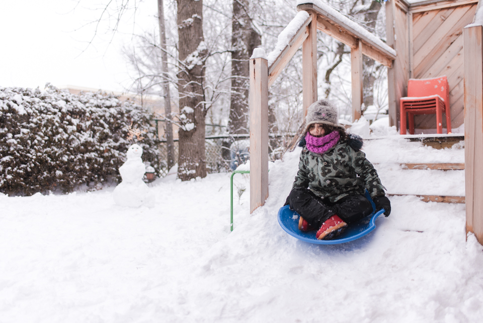 girl on saucer sled - Family Documentary Photography