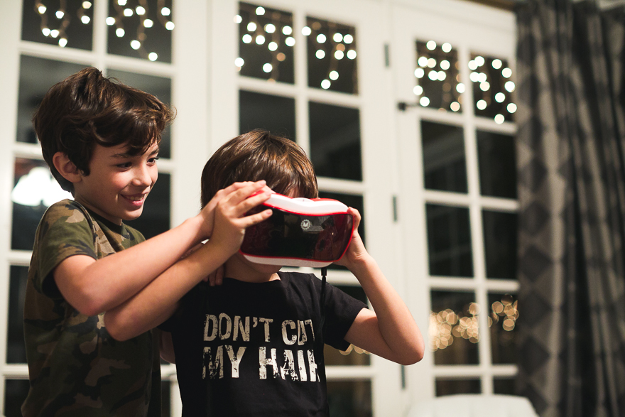 boys looking in viewfinder toy - Family Documentary Photography