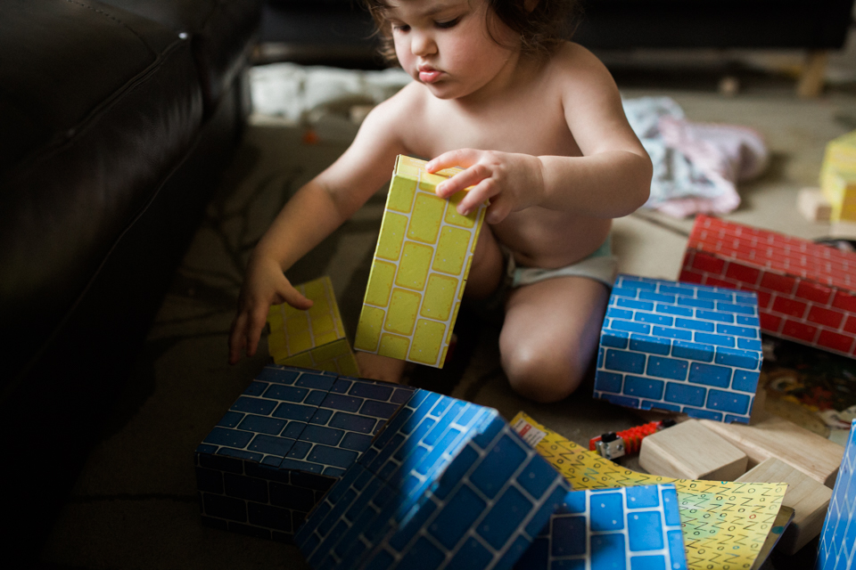 girl with cardboard blocks - Documentary Family Photography