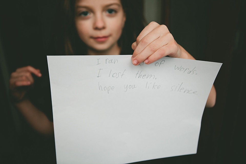 Girl with paper - Documentary Family Photography