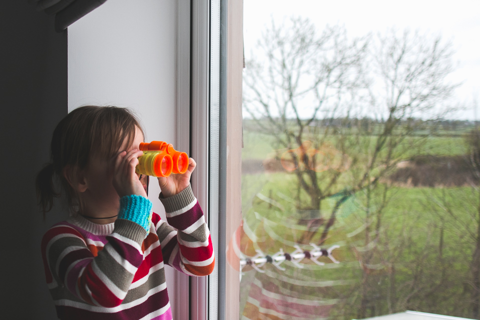 Girl with binoculars - Documentary Family Photography