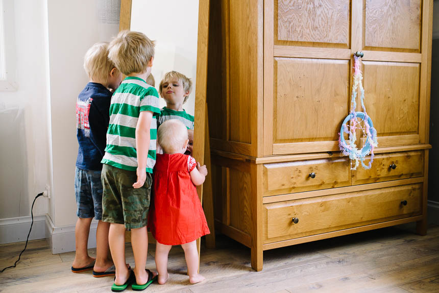 kids making faces in mirror - Documentary Family Photography