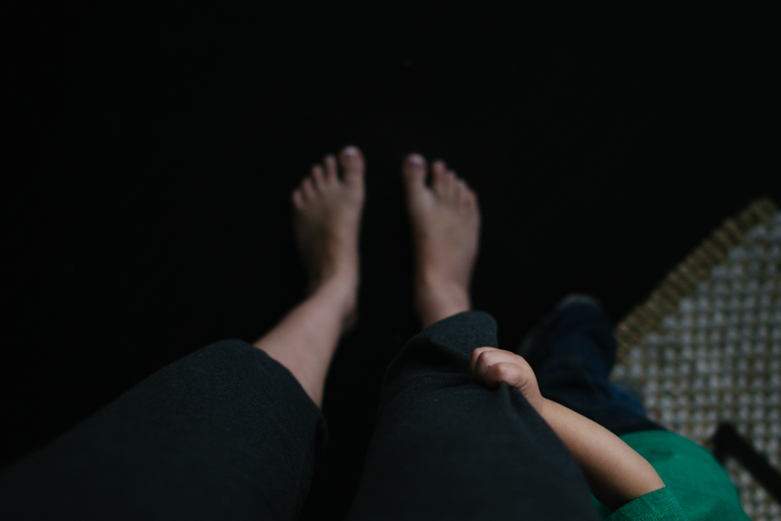 child holding mom's pant leg - Documentary Family Photography