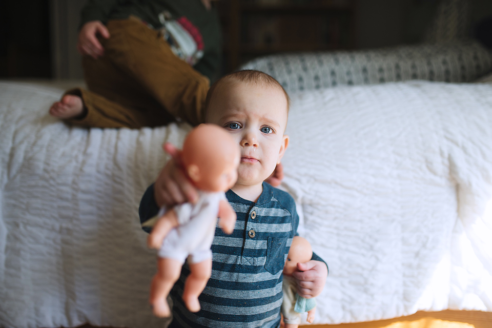 baby with baby doll - Documentary Family Photography