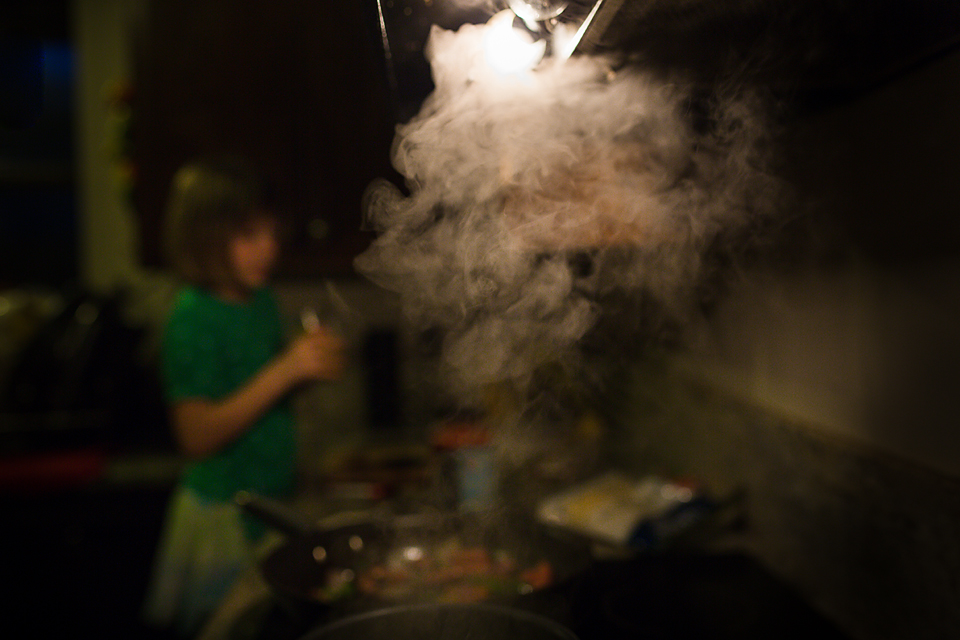 girl at steaming pot - Documentary Family Photography